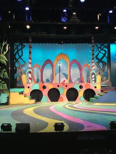 the stage is set for an animated show with colorful decorations and lights on it's walls