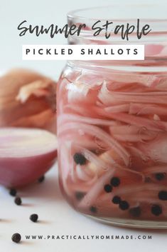 a jar filled with pickled shallots next to an onion