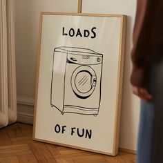 there is a sign that says loads of fun next to a washer dryer