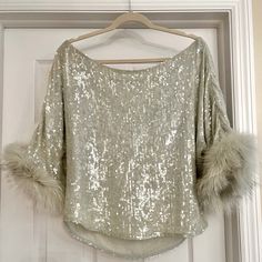 Amazing Mint Green Feather And Sequence Loose Fit Off The Shoulder Top . Fits Like A Large . Can Be Dressed Up Or Down Amazing For The Holidays ! Beautiful Color Silvery Mint Luxury Winter Party Tops, Mint Green Top, Mint Green Tops, Green Feather, Green Top, Off The Shoulder Top, Mint Green, Beautiful Colors, Shoulder Top