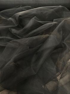 black sheer fabric on top of a couch