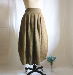 " *Elastic waist *Pleated skirt *two pockets at each side *Length approx: 80cm/31.5\" *Wash by hand or machine with cold water Auailable in women's us size XXS to 3XL as well as custom size and plus size  XXS: Waist:66cm/26\" Length:80cm/31.5\" XS: Waist:70cm/27.5\" Length:80cm/31.5\" S: Waist:74cm/29\" Length:80cm/31.5\" M: Waist:78cm/30.5\" Length:80cm/31.5\" L: Waist:82cm/32\" Length:80cm/31.5\" XL: Waist:86cm/33.8\" Length:80cm/31.5\" XXL: Waist:90cm/35.5\" Length:80cm/31.5\" 3XL: Waist:94cm Khaki Midi Skirt With Pockets, Baggy Knee-length Summer Skirt, Khaki Wide Leg Skirt With Pockets, Loosely Fitted Long Summer Skirt, Khaki Midi Skirt For Summer, Khaki Skirt With Pockets For Summer, Summer Khaki Skirt With Pockets, Fitted Beige Linen Maxi Skirt, Pleated Linen Long Skirt