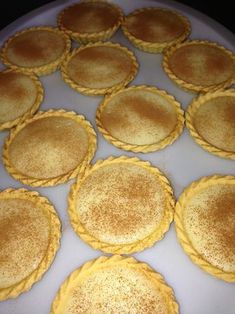 there are many small pies on the pan ready to be baked in the oven