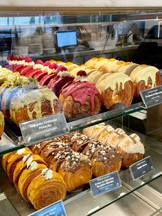 a display case filled with lots of different types of pastries