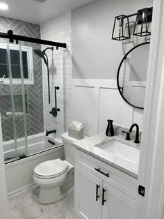 a bathroom with a toilet, sink and shower