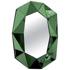 a mirror that is made out of green glass and has diamonds on the front side