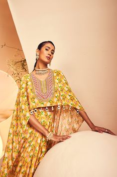 featuring a high-low top paired with a draped dhoti skirt in a modern floral print. The neckline is embroidered fully by hand with intricate Japanese cutdana and bead embroidery. From Aneesh Agarwaal's Naksh collection. DELIVERY TIMEPlease allow 8-12 weeks for your outfit to arrive. FABRIC DETAILSCrepe Professional cleaning only. Dhoti Skirt, High Low Top, 12 Weeks, Professional Cleaning, Modern Floral, Bead Embroidery, Beaded Embroidery, Skirt Length, Low Top