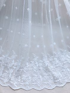 Soft floral embroidery lace fabric by the yard. Perfect for dress making, bridal wear, wedding gown, flower girl dress or curtains. Listing is for ONE YARD. ( Additional quantities are available.) Fabric width approx: 53.1 Inches (135 cm) ..♥ ¸¸..♥ ¸¸..♥ ..♥ ¸¸..♥ ¸¸..♥.. Wholesale acceptable! MORE FABRICS https://www.etsy.com/shop/lacelindsay?section_id=14156869 Feel free to contact me with any questions. To view all our items please click here: .**' http://www.etsy.com/shop/lacelindsay .**' White Embroidered Fabric With Lace Trim For Ceremonies, Ceremony White Dress With Intricate Embroidery, White Embroidered Lace Fabric For Ceremony, Ceremonial White Embroidered Fabric With Lace Work, White Floral Embroidered Lace For Summer Wedding, White Floral Embroidery Lace For Summer Weddings, Summer Wedding Lace With Floral Embroidery, White Lace Trim Wedding Dress For Ceremony, White Wedding Dress With Lace Trim For Ceremony