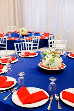 the table is set with red, white and blue linens for an elegant dinner