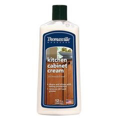 a bottle of kitchen cabinet cream on a white background