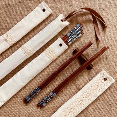 four pieces of wood and fabric sitting on top of a cloth covered floor next to each other