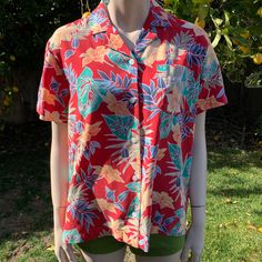 This is a vintage 90s LIZGOLF by Liz Claiborne Hawaiian shirt I love that it's the perfect Hawaiian shirt, bright in color and had monstera leaves on it Perfection 👏🏼 Tag size is a medium (think women's medium though) I'm pretty sure this was made/sold for women but I feel like it's totally unisex  It is 100% rayon, lightweight soft and comfy! I haven't noticed any flaws  This will make such a lovely shirt for someone. If keep it if it were my size! Measurements as follows: Pit to pit laying f Casual Red Tropical Print Camp Shirt, Casual Red Floral Print Camp Shirt, Red Collared Hawaiian Top, Red Tropical Print Top With Camp Collar, Red Camp Collar Top With Tropical Print, Red Printed Tops With Camp Collar, Red Printed Top With Camp Collar, Red Casual Collared Hawaiian Shirt, Tropical Print Collared Tops