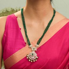 Description : Discover regal opulence with the Amira CZ necklace from Tarinika's festive collection. Inspired by classic Indian designs, this necklace is handcrafted with CZ stones & three-layer emerald beads tassel on gold polish to highlight your festive outfit. Details & Specifications: Materials used: CZ Stone with White Gold Plating Weight - Necklace 42.93 gms Length - Necklace 29 cms Make it custom Want to make it a custom necklace? Sure! Reach out to us at support@tarinika.com and we’ll b Emerald Temple Jewelry Necklace For Festive Occasion, Temple Jewelry Style Emerald Necklace For Celebration, Temple Style Emerald Necklace For Celebrations, Festive Emerald Necklace With Intricate Design, Festive Temple Emerald Necklace For Celebration, Bollywood Emerald Necklace For Festive Occasions, Bollywood Style Festive Emerald Necklaces, Bollywood Style Festive Emerald Necklace, Emerald Temple Jewelry Necklace For Festivals