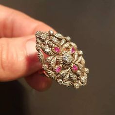 "RING SIZE: 7.5 US 56 EU GOLD: 14 ct. WEIGHT: 11.70 grams SIZE: 35 mm x 23 mm RUBIES: authentic, 0.35 ct. DIAMONDS TOTAL WEIGHT: 0.40 ct CUT: pink cut, in the center is an old European diamond COLOUR: K CLARITY: Si2 CONDITION: EXCELLENT Stunning Art Deco style diamond and ruby ring with a beautiful floral design. The ring features 14 carat gold Hungarian \"fox heads\" from 1867 to 1922. Rose cut diamonds and one old european cut Si2 clarity and K color total 0.40 ct and uncut, genuine rubies 0.3 Antique Gold Ruby Ring Stamped 14k, Gold Ruby Rings With Intricate Design, Yellow Gold Ruby Ring With Intricate Design For Promise, Ornate 14k Gold Collectible Ring, Antique Gold Ruby Ring With Diamonds, Antique Rose Gold Rings With Diamond Cut, Antique Rose Gold Diamond Cut Ring, Antique Diamond Cut Rose Gold Ring, Gold Ruby Ring With Intricate Design