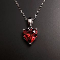 Solid Sterling Silver Garnet birthstone heart pendant, with Sterling Silver 18 inch chain. January Birthstone necklace making the perfect January birthday gift. Matching earrings available here: https://www.etsy.com/listing/1352764891/ Available to order in gold, white gold, rose gold or platinum, please contact me for prices.  💎Pendant thickness: 6mm 💎Pendant width: 9mm 💎Pendant overall Length: 17mm 💎Chain length: 18 inch or other length if required.  ✨ For free giveaways, special offers an Heart Cut Birthstone Jewelry Gift, Gift Heart Cut Gemstone Birthstone Necklace, Heart Cut Gemstone Birthstone Necklace Gift, Sterling Silver Heart Cut Birthstone Necklace For Gift, Red Heart Necklace With Birthstone As Gift, Red Heart Necklace With Birthstone For Gift, Red Heart Birthstone Necklace Gift, Heart Cut Birthstone Necklace As A Gift, Heart Necklace With Gemstone For Gifts