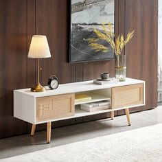 a living room with a white table and yellow lamp