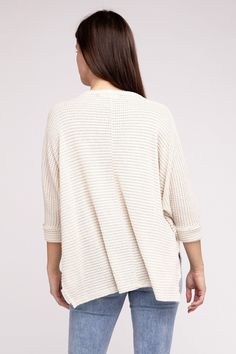 Elevate your spring wardrobe with our Zenana Waffle Knit 3/4 Sleeve Top. This lightweight top features a comfortable oversized fit. The V-neckline and hi-low hem add a touch of elegance, while the side slits provide extra comfort. Dress it up with white jeans or dress pants or keep it casual with denim shorts or jeans. You'll love the versatility of this waffle top! Neckline: V-neckline Features: Side Slits Fabric: Waffle knit texture Hemline: Hi-low hem Sheer: Semi-sheer Sleeve: 3/4 Sleeve Stre Spring Textured Knit Long Sleeve Crew Neck Top, Spring Crew Neck Long Sleeve Top With Textured Knit, Oversized Long Sleeve Top For Spring, Oversized Soft Knit Top For Spring, Versatile Textured Knit Tops For Spring, Casual Spring Sweater For Brunch, Casual Cotton Sweater With 3/4 Sleeves, Cream Knit Top For Spring Layering, Spring Brunch Knit Top