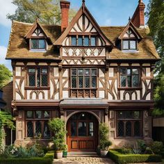 a large brown and white house with lots of windows