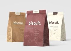 three different types of coffee bags in various colors and sizes, with the words biscuit printed on them