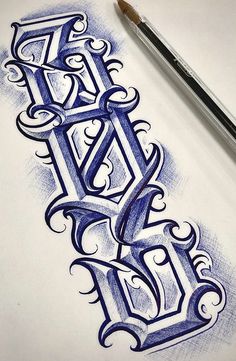 a drawing of the letter e on paper with a pencil next to it and an ink pen