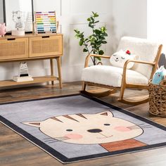 a cat rug is on the floor next to a rocking chair