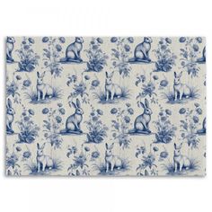 a blue and white wallpaper with rabbits on it