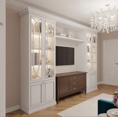 a living room filled with furniture and a chandelier