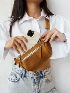 This leather hip bag is perfect for traveling or just to carry in your everyday bag. The personalized fanny pack will help you to keep all necessary staff like phone, wallet, cards, face mask in one place during the day. You can wear it as a belt bag or like a fanny pack or crossbody bag - it's up to your mood :) Great idea for birthday gift or Mother's day gift ! Bag can be personalized monogram. The Funny backpack is made from one piece quality Crazy Horse. When you hold it in your hands, you Bum Bag Outfit, Trendy Belts, Leather Hip Bag, Leather Waist Bag, Minimalist Bag, Leather Fanny Pack, Leather Belt Bag, Crossbody Bag Women, Hip Bag