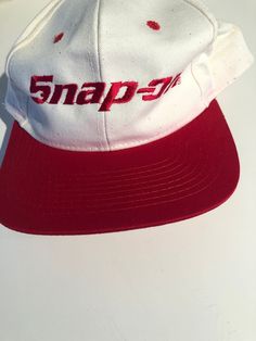 Snap-On White and Red Baseball Hat Adjustable  SnapBack There is some red face on the white along the brim and sides Purchase price includes free shipping in Canada and USA International shipping is available, please contact before purchase for shipping quote Any questions, just ask!  Vintage item, regular wear due to age should be expected Any known flaws/ markings will be listed No returns/ exchanges,  it please contact if there is an issue with your item Retro Red Hats With Flat Bill, Vintage White Baseball Cap For Streetwear, Retro Red Hat With Flat Bill, Vintage Red Flat Bill Baseball Cap, Retro Red Flat Bill Hat, Retro Red Snapback Hat With Curved Brim, White Retro Snapback Hat With Curved Brim, Retro Red Visor Baseball Cap, Retro Red Snapback Cap