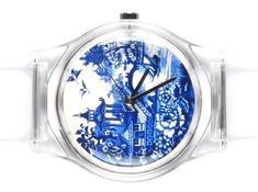 a watch with blue and white designs on the face