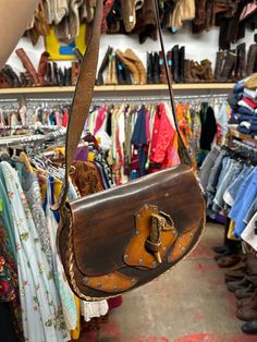 "BAG'S HEIGHT 8\" by Width 12 inches BAG'S HEIGHT WHEN HUNG FROM A SHOULDER 23\" BAG'S BOTTOM depth 3.25\" SHOULDER STRAP 36\"" Hand-tooled Saddle Bags, Retro Hand-tooled Bags, Western-themed Brown Leather Shoulder Bag, Leather Hand Tooled Shoulder Bag For Western-themed Events, Hand Tooled Leather Bags For Western-themed Events, Hand-tooled Leather Bags For Western-themed Events, Brown Motorcycle Boots, 49ers Jacket, Handmade Leather Shoulder Bag