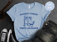 Step up your humor game with our "Waddle Y'Know Thicc As Flock" Shirt! This playful tee combines a cute goose design with a hilarious pun, making it a must-have for anyone who loves to stand out with their style and wit. Perfect for animal lovers and pun enthusiasts alike. 🦢 Hilarious Design: Featuring a goose admiring its reflection with the phrase "Waddle Y'Know Thicc As Flock," this shirt is sure to make people laugh. 👕 Comfortable Fit: Crafted from soft, high-quality fabric, this tee ensur Cute Goose, Bird Shirt, People Laughing, Blue Canvas, Shirts For Women, Funny Shirt, Gag Gifts