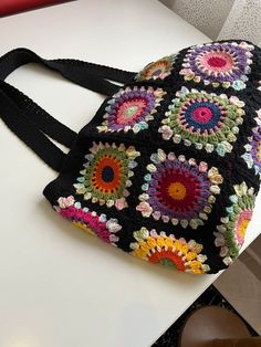 Handmade Black Shoulder Bag 🖤 Alize Cotton Gold 🧶 It can be washed in the hand wash program at 30 C (36 F) 🧼 It was crocheted with care and love for you. 🥰 You can ask your questions about the bag. 💡 You can message us for your customized orders. 💬 Bohemian Black Crochet Bag With Granny Square, Black Square Crochet Bag Bohemian Style, Black Bohemian Crochet Bag With Granny Square, Black Crochet Travel Bag, Black Crochet Bag With Granny Square For Everyday Use, Black Bohemian Crochet Square Bag, Black Square Bohemian Crochet Bag, Handmade Black Crochet Bag As A Gift, Handmade Black Crochet Bag As Gift