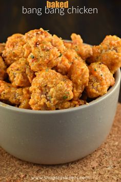 a bowl filled with meatballs sitting on top of a table