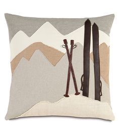 a pillow with skis and poles on it