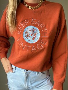 "Upcycled vintage rust colored oversized sweatshirt with baby blue Keep Earth Vintage logo embroidered by small, woman-owned embroidery artist. By purchasing this item, you are supporting a small business, a local embroidery artist and saving a piece of clothing from potentially ending up in a landfill or incinerator while receiving a one-of-a-kind sweatshirt! 50% cotton | 50% polyester | M Recommended for size S-XL depending on desired drape & styling but please always refer to measurements as Retro Embroidered Sweatshirt For Fall, Brown Long Sleeve Sweatshirt With Embroidered Logo, Retro Brown Cotton Sweatshirt, Vintage Oversized Brown Sweatshirt, Oversized Vintage Brown Sweatshirt, Retro Embroidered Cotton Sweater, Vintage Crew Sweater With Embroidered Logo, Retro Fall Sweatshirt With Embroidered Logo, Retro Cotton Embroidered Sweater