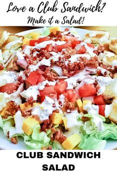 a salad with lettuce, tomatoes and other toppings is shown on a white plate