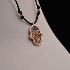 Our Specially Designed Hamsa Hand Necklace was prepared in Silver, Gold plated over silver or rose plated. The figure was engraved on Hamsa Hand using micro mosaic technique on silver. Hamsa Hand is also used as a lucky charm. It is believed that those who carry this figure will gain the virtues of patience and loyalty. It is used as a symbol of abundance, fertility and luck. Hamsa hand is believed to protect from evil eyes. It is also used as a peace sign. You can find our Hamsa Hand Necklace d Rose Gold Spiritual Necklace, Adjustable Rose Gold Necklace With Lobster Clasp, Nickel-free Rose Gold Copper Necklace, Multicolor Copper Jewelry For Gift, Adjustable Engraved Rose Gold Necklace, Adjustable Silver Copper Necklace, Adjustable Copper Silver Necklace, Handmade Rose Gold Metal Necklace, Hamsa Hand Necklace