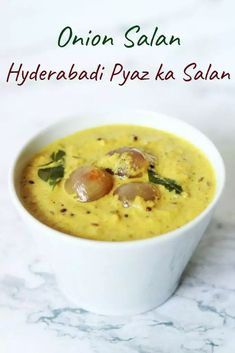 a close up of a bowl of food on a table with the words onion sala