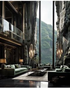 a living room filled with lots of furniture next to a tall wall covered in rocks