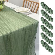 the table is set with green linens and place settings