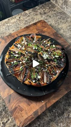 a pizza sitting on top of a wooden cutting board