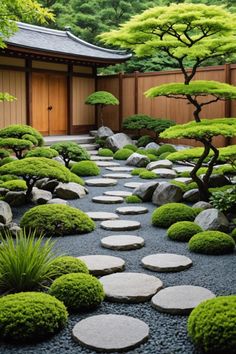 a garden with rocks and trees in the center, surrounded by graveled walkways