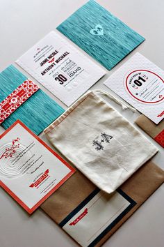 the wedding stationery is laid out neatly on top of each other, including napkins