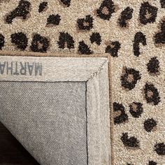 an animal print rug with the name william written on it