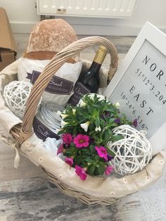 a basket filled with flowers next to a bottle of wine and a sign that says error