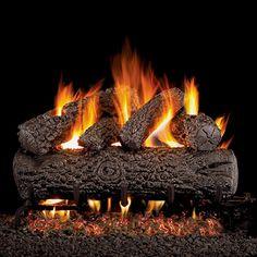 a fire is burning in the fireplace with logs