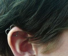 an ear piercing is seen in this image