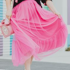 Now This Is A Wonderful Pop Of Color For This Season. Very Bright And Exciting! We Know This Can Be Worn In So Many Magical Ways At So Many Magical Occasions. Be Casual With A Fun Tee And Sneakers Or Pair It With One Of Our Feminine Bodysuits. Add Some Heels And You're Set For A Fun Day. Tulle Midi Skirt With Flowy Silhouette Shirred And Tiered Design. 100% Polyester Casual Spring Tulle Skirt, Pink Tulle Maxi Skirt For Summer, Casual Tulle Maxi Skirt For Spring, Cute Tiered Tulle Skirt, Casual Pink Maxi Skirt For Party, Pink Ruffled Full Skirt Bottoms, Cute Pink Flared Skirt, Cute Flowy Pink Skirt, Cute Pink Flowy Skirt