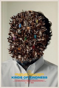 a man's head is covered in many small objects